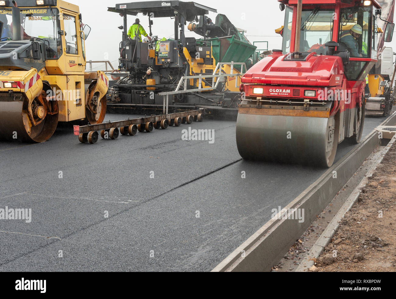 Paver and compactors in action Stock Photo Alamy