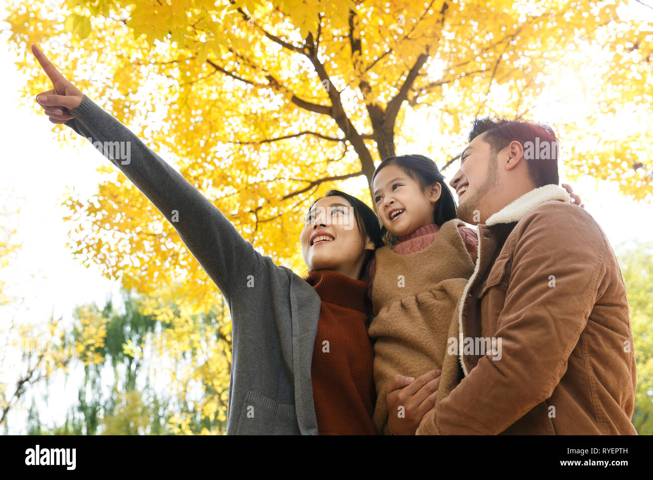 Three play outdoors Stock Photo Alamy