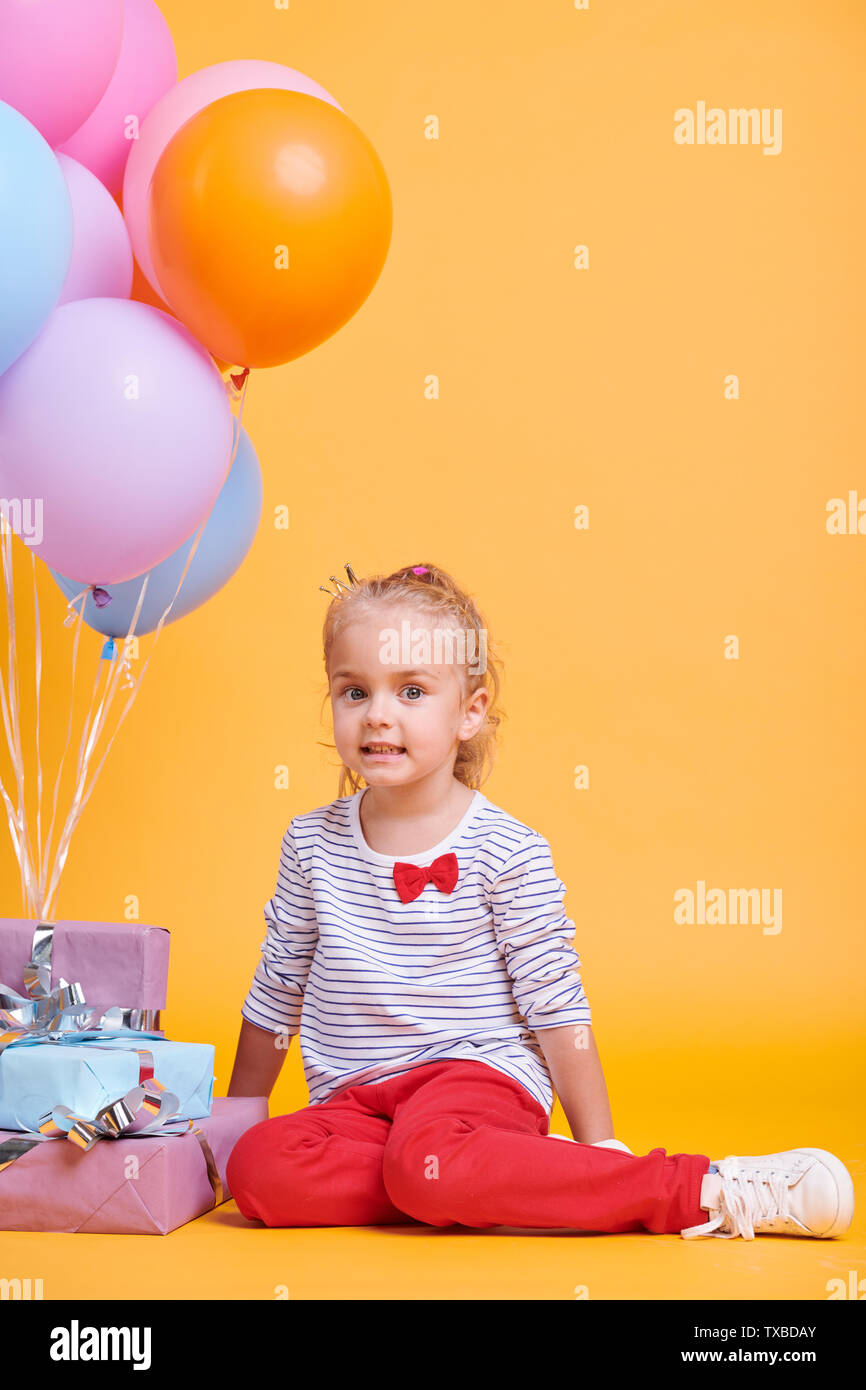Girl with balloons and gifts Stock Photo Alamy