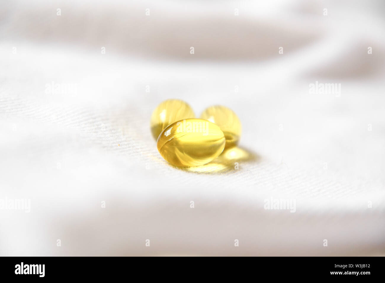 Fish oil pill isolated on white Stock Photo Alamy