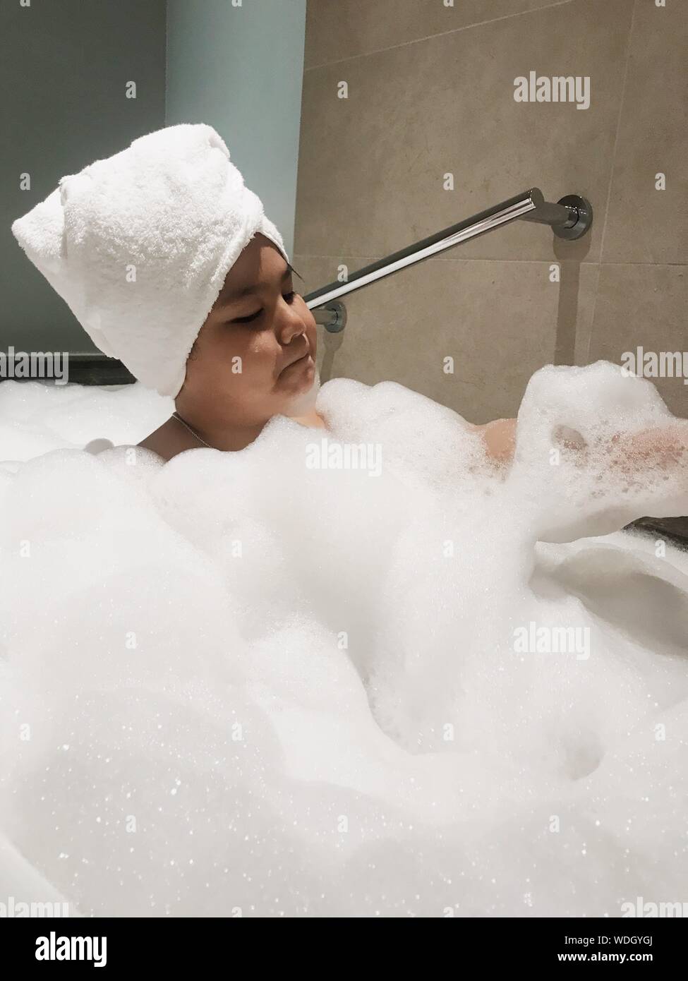 Boy Taking Bubble Bath Stock Photos & Boy Taking Bubble Bath Stock