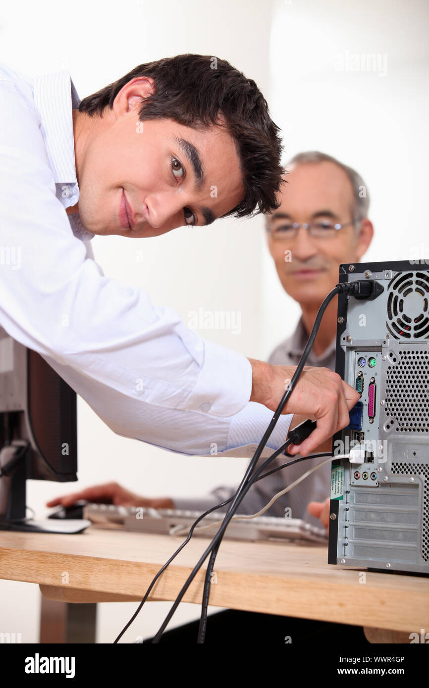 Setting up computer Stock Photo Alamy