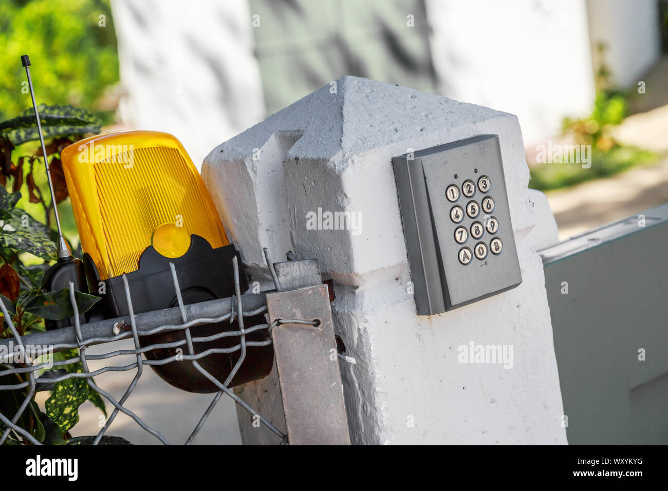Automatic gate opening system and intercom access Stock Photo - Alamy