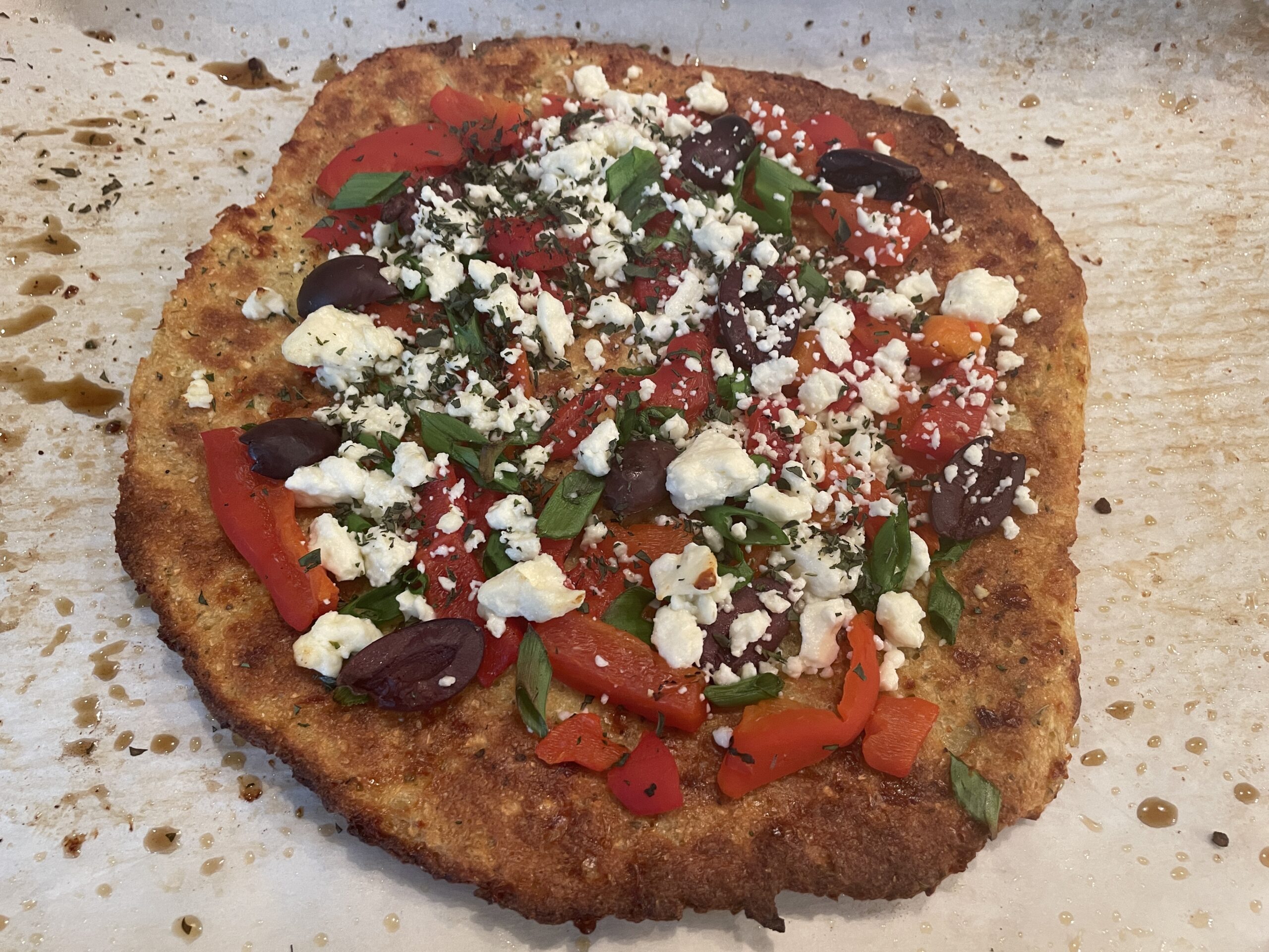 Cauliflowercrust pizza with feta, peppers, and olives Cajun Chef Ryan