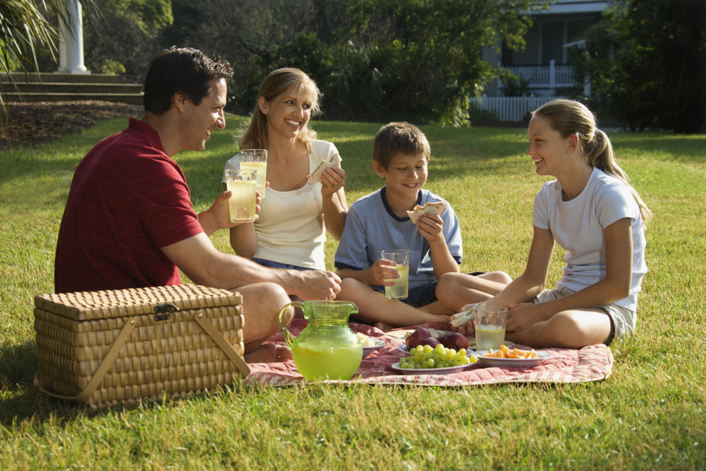 Family having picnic in park. Calorie Control Council