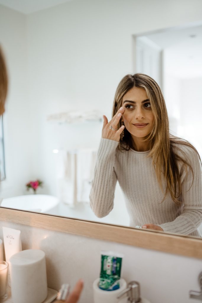 liana levi putting on makeup