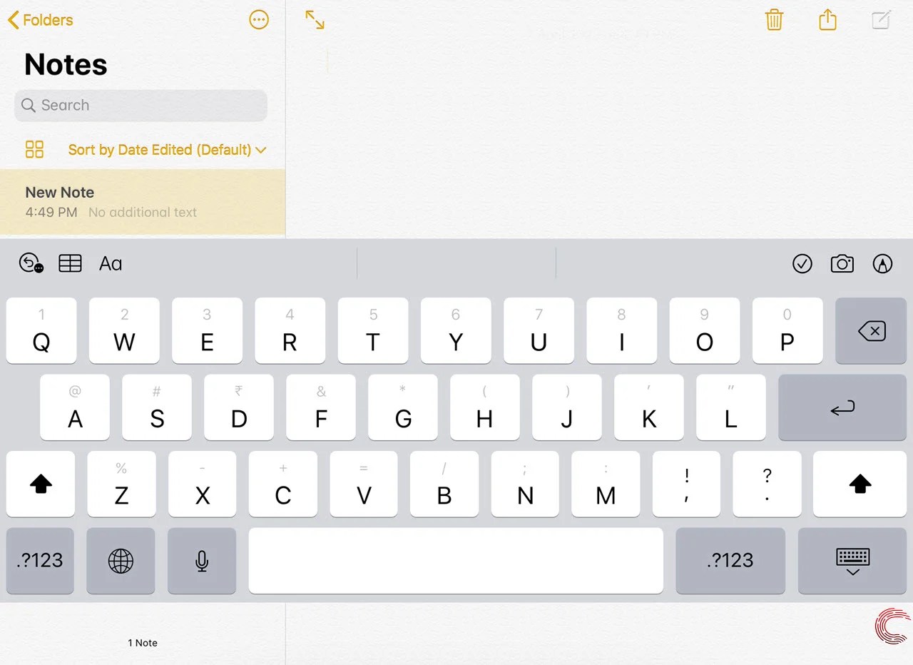 How to change iPad keyboard back to normal from split?