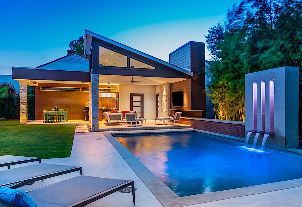 Residential carports combine aesthetics and functionality in custom pool homes.