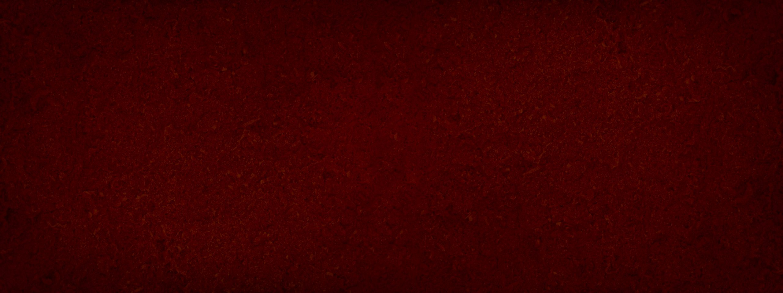 Red abstract background. Toned fiberboard texture. Closeup. Burgundy