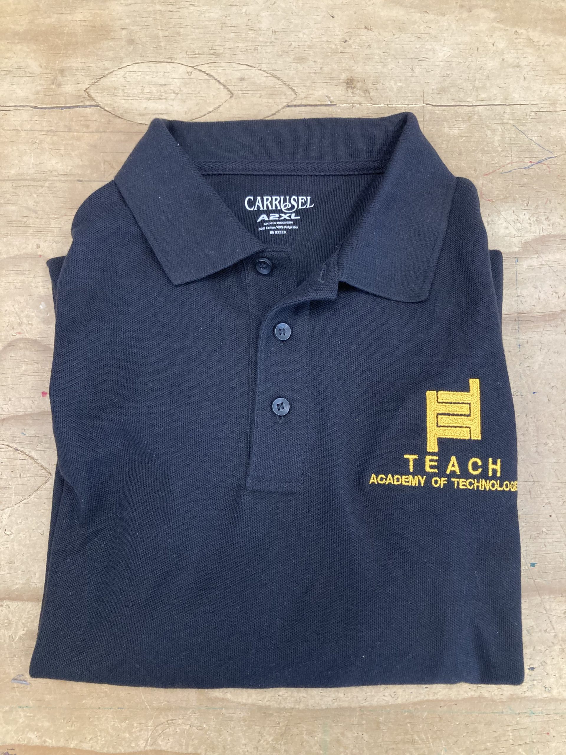 Teach Middle Black Polo Carrusel Uniforms and Embroidery