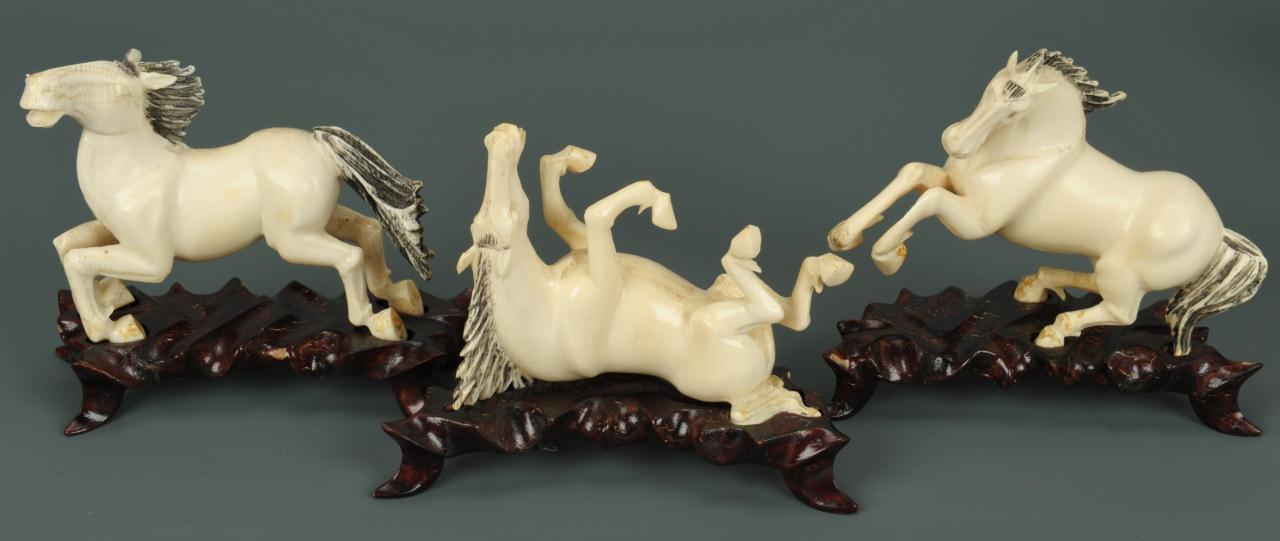 Lot 15 Eight Chinese carved ivory horses of Mu Wang