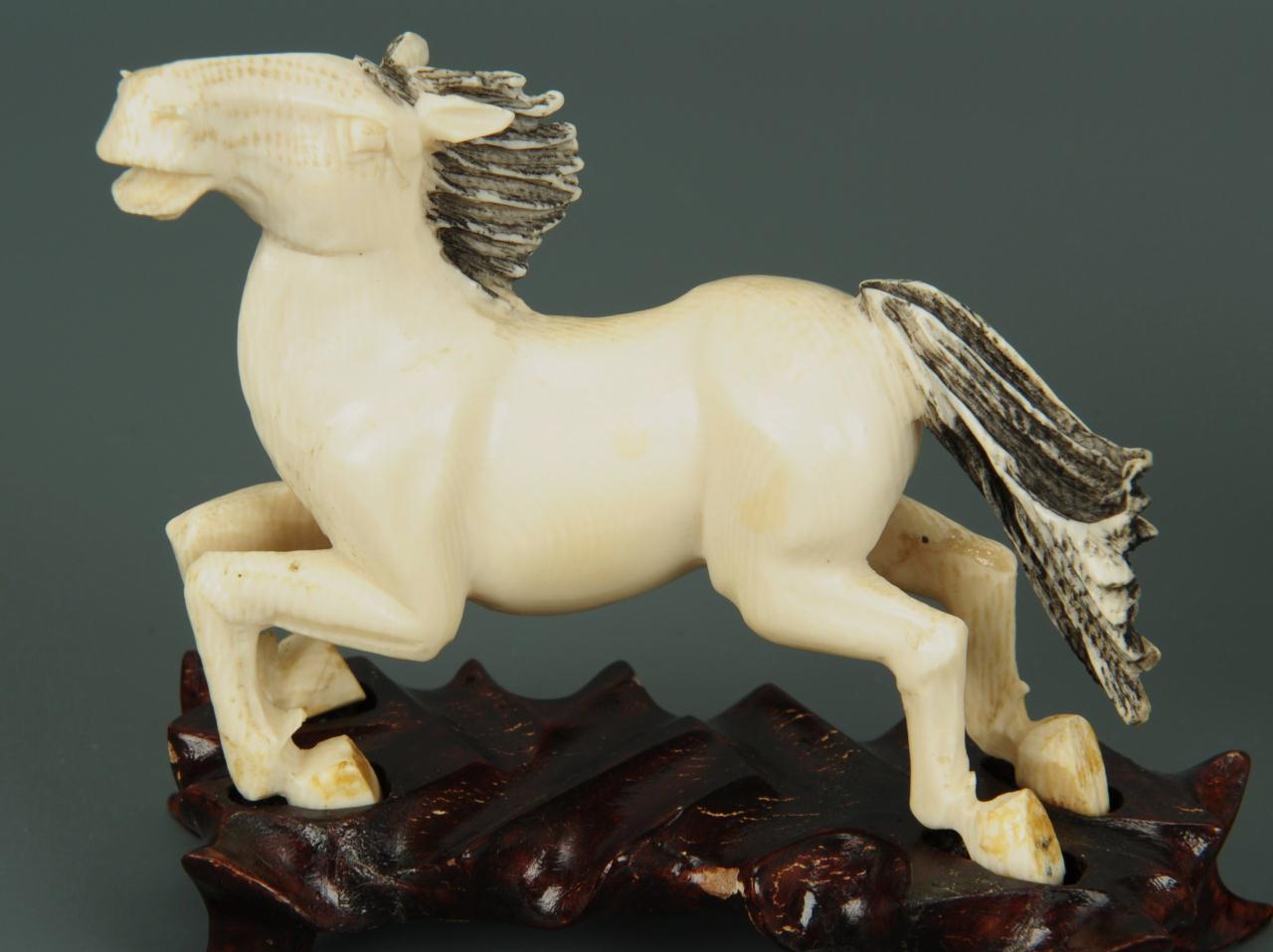 Lot 15 Eight Chinese carved ivory horses of Mu Wang Case Auctions