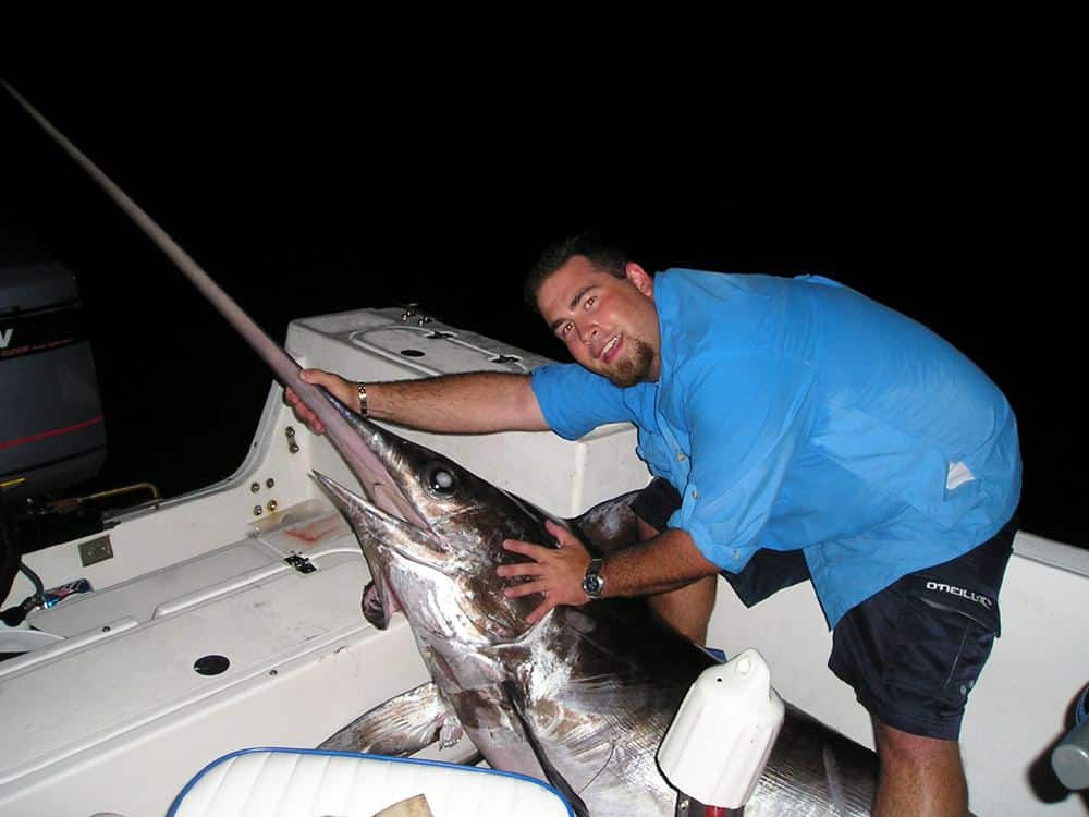 Alan massaging a massive Swordfish Catch Fly Fishing