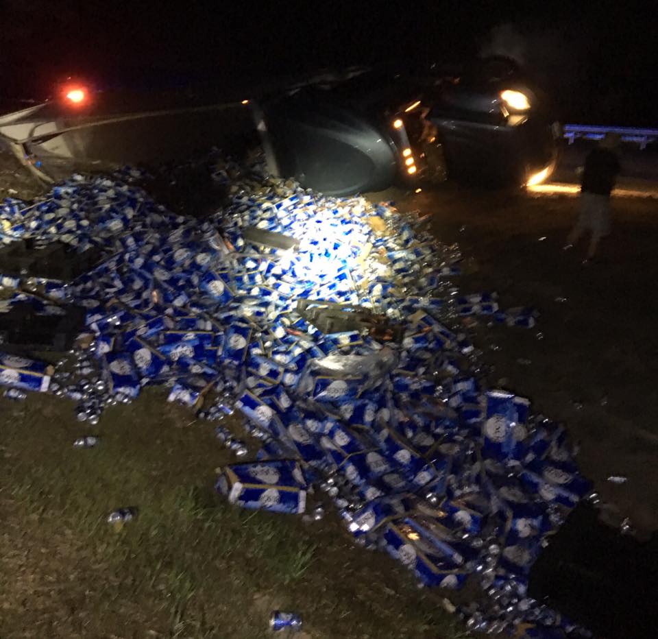 Tipped truck dumps 60,000 pounds of beer on I10