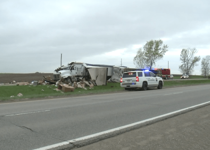 Trucker survives crashing through semi trailer lying across highway