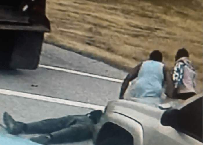 Trucker sucker punched and left K.O.'ed on the shoulder by motorist