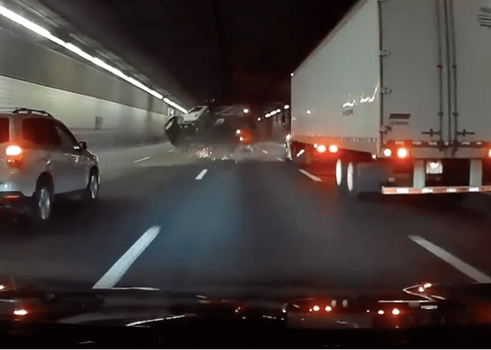 Dash cam catches violent dump truck rollover in O'Neill Tunnel