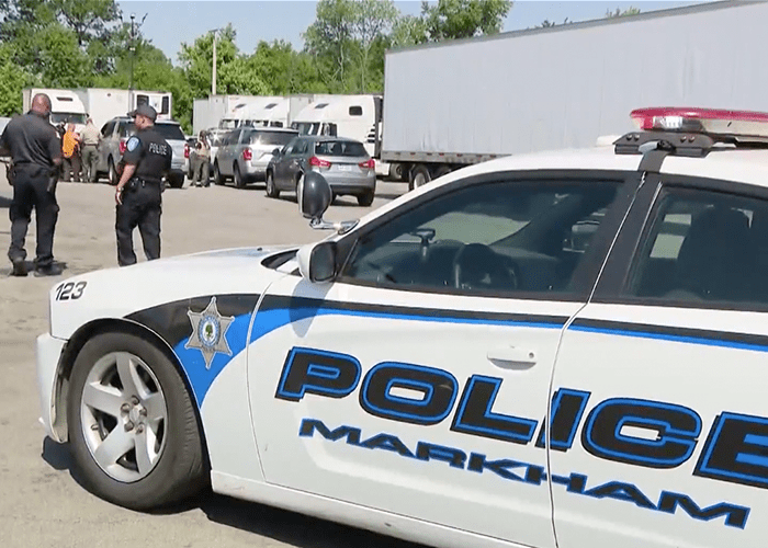 Truck driver shot by police after allegedly threatening officer with knives
