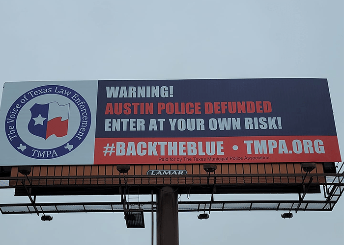 Billboards on I35 warn drivers approaching Austin to 'enter at your