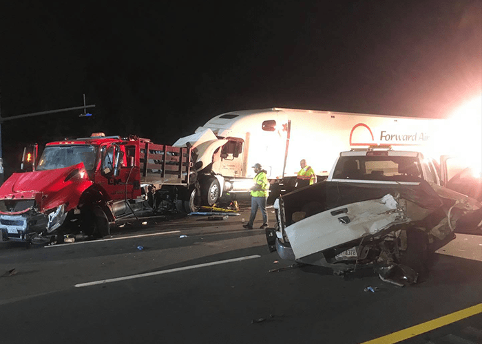 One dead in early morning crash involving construction vehicles in