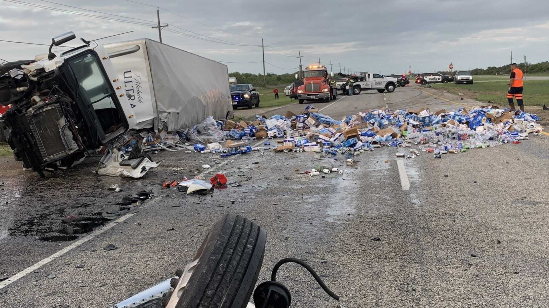 Load of beer spilled after motorist pulls out in front of moving semi truck