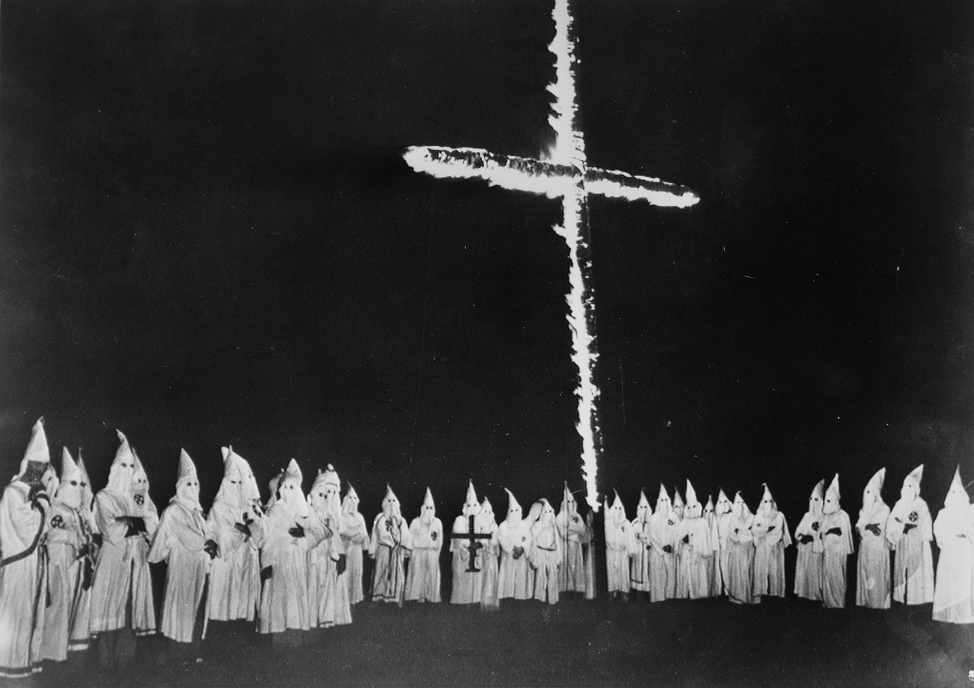 Why does the Ku Klux Klan burn crosses? They got the idea from a movie.