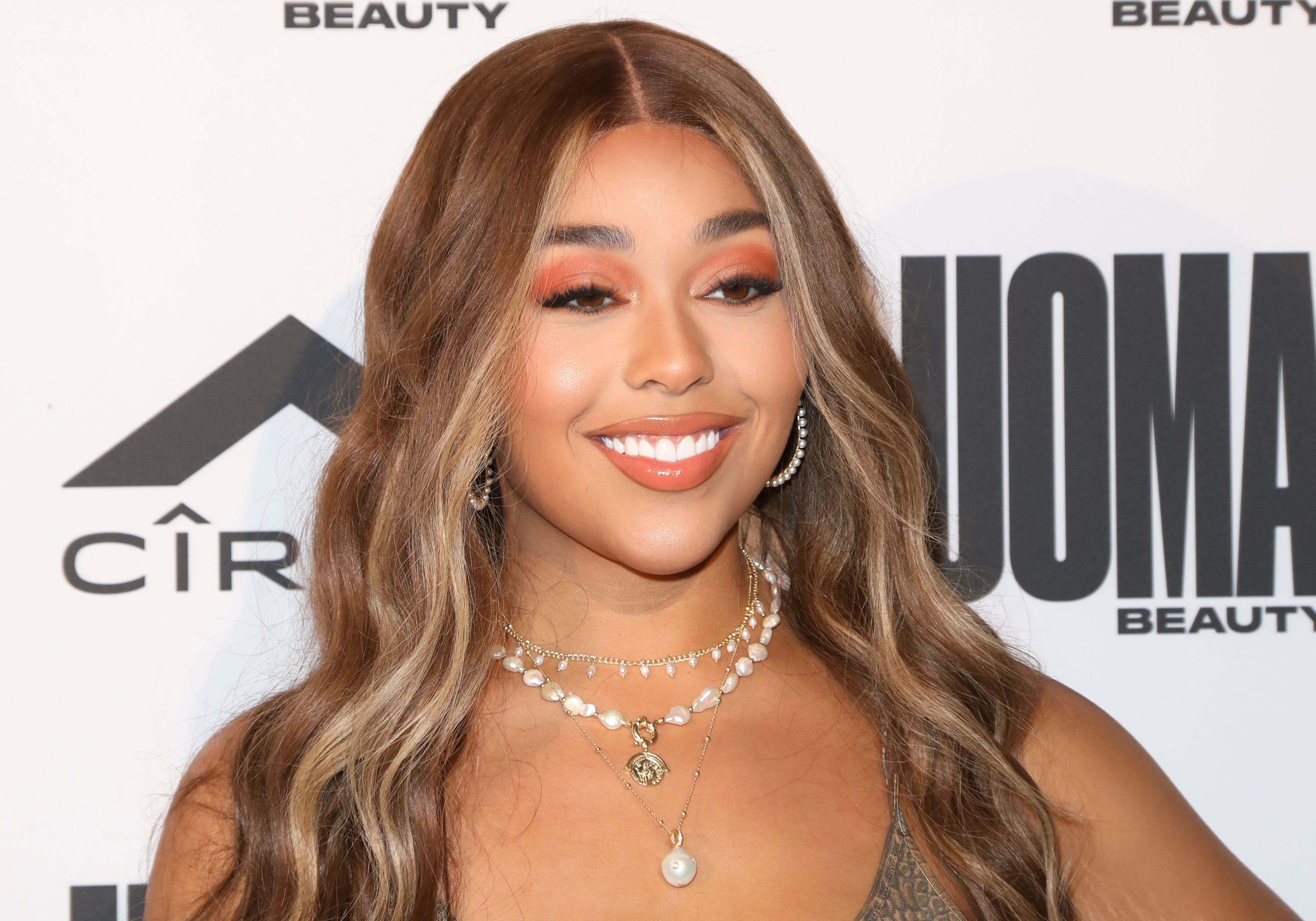 Jordyn Woods Wears Vintage Dior Scarf like a Crop Top with Olive Green