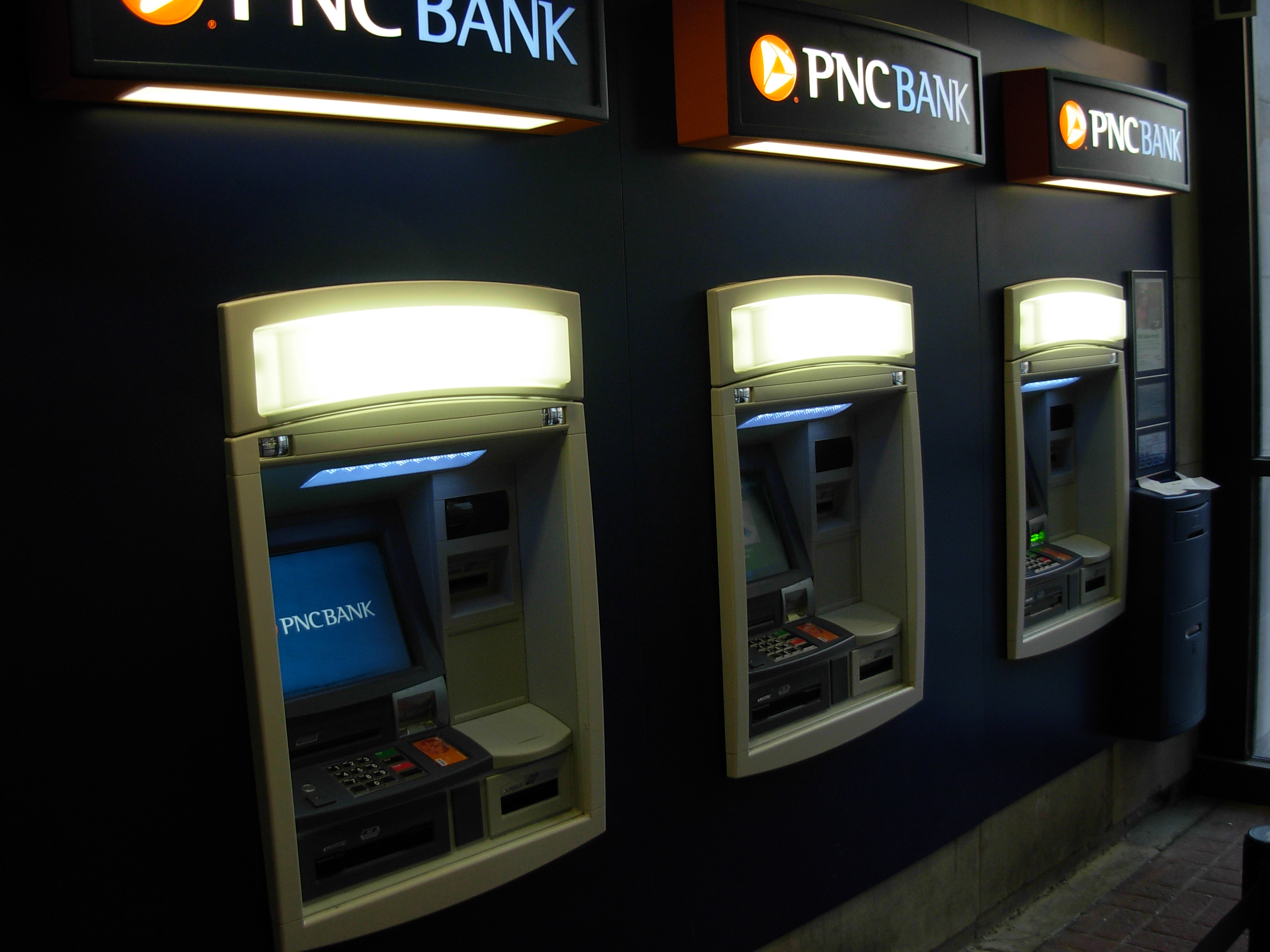 Two members of ATM skimming ring plead guilty to bank