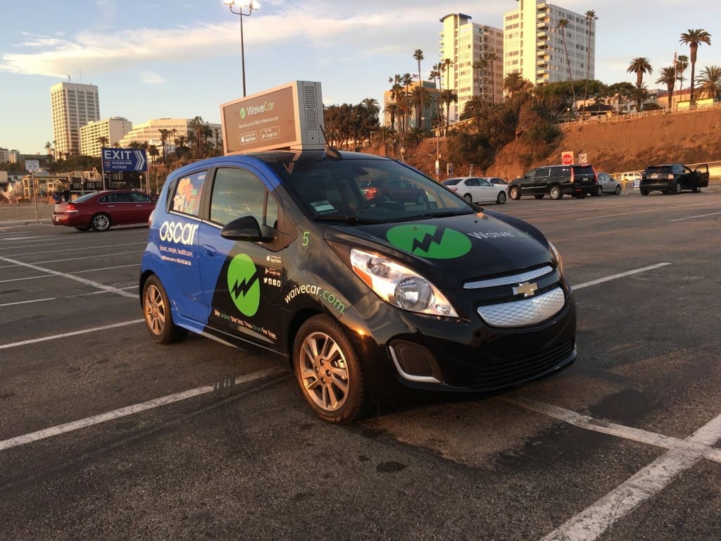 Waive the fee drive free as an EV billboard new free car service