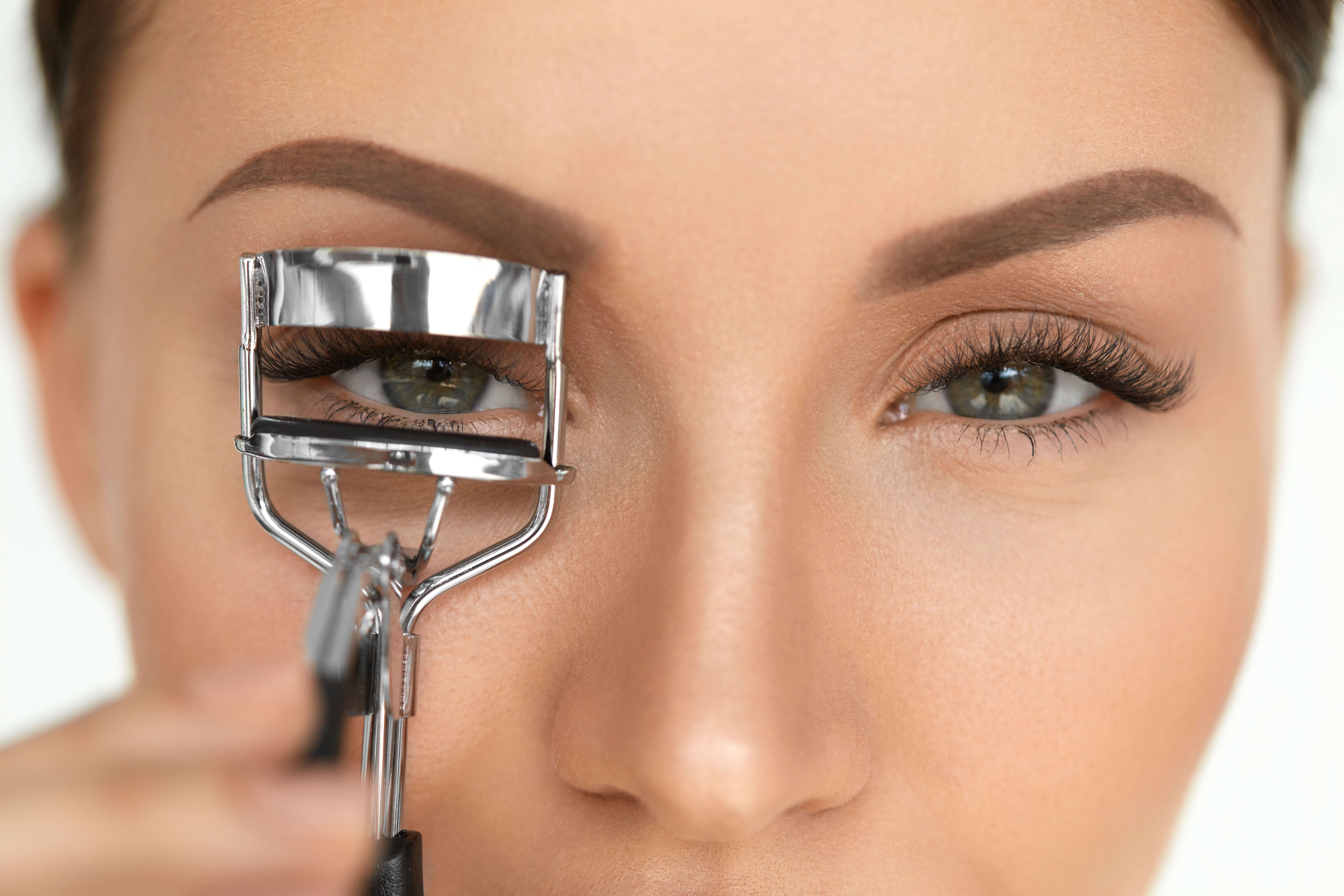 Beautiful Woman Using Eyelash Curler On Curly Long Beautiful Woman Using Eyelash Curler On Curly Long