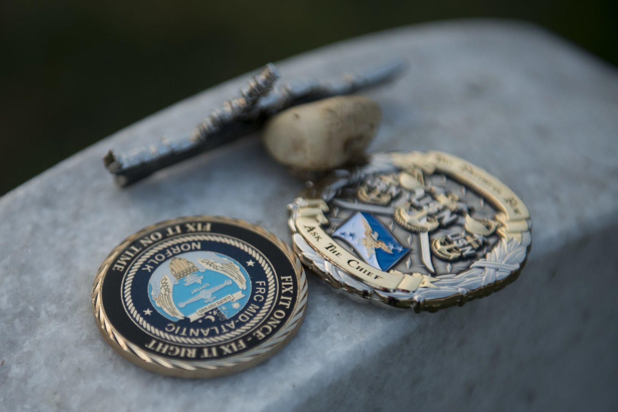 What Do Those Coins Left on Soldiers’ Graves Actually Mean?