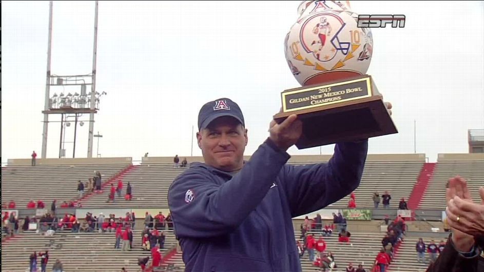 Rich Rodriguez and Arizona presented with Gildan New Mexico Bowl trophy