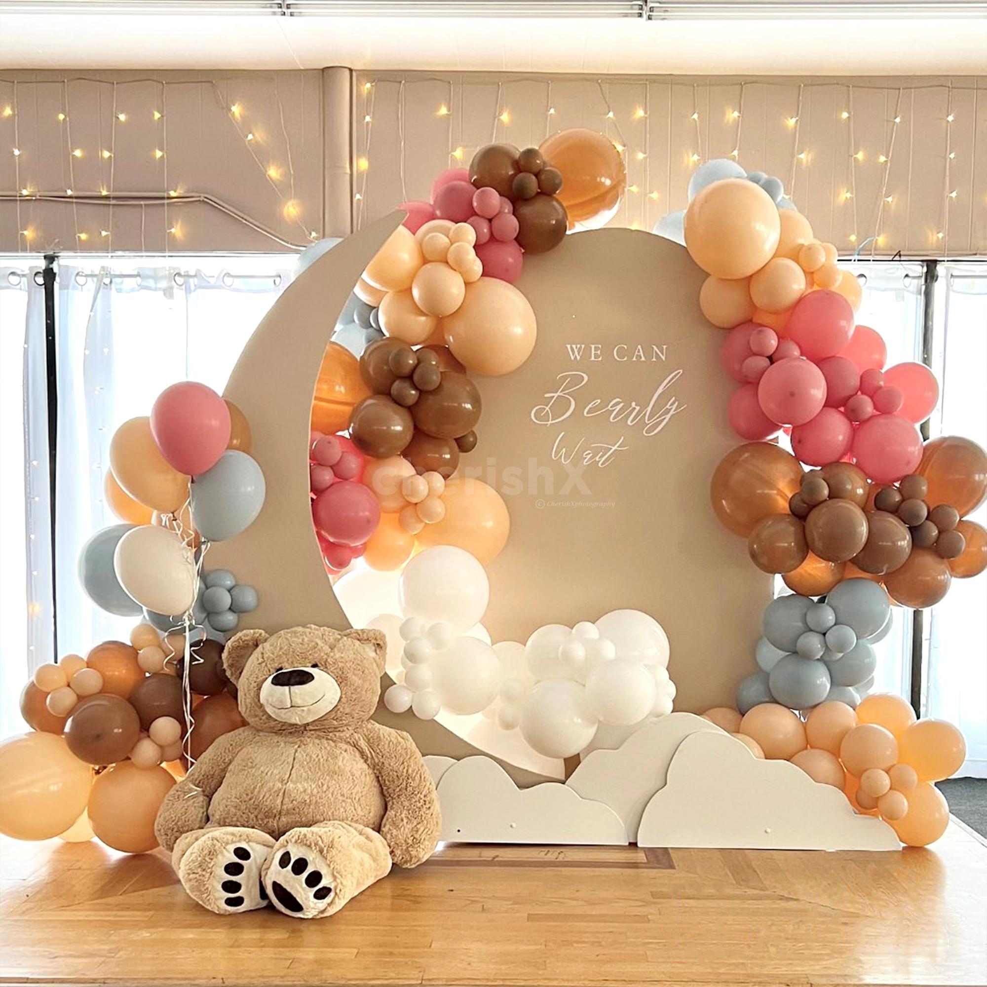 Unveil an adorable bash with this multi colored baby shower decoration