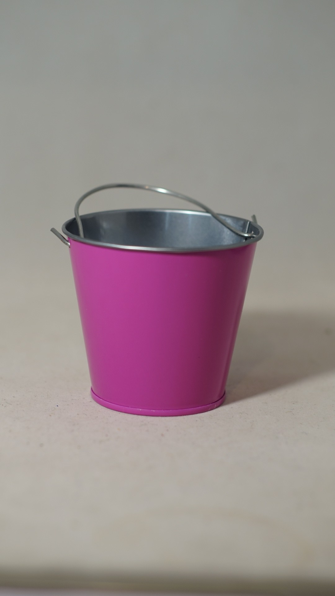 Small pink metal bucket
