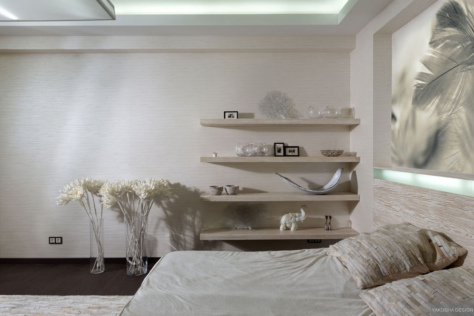 textured white bedroom with collectables displayed on shelving and
