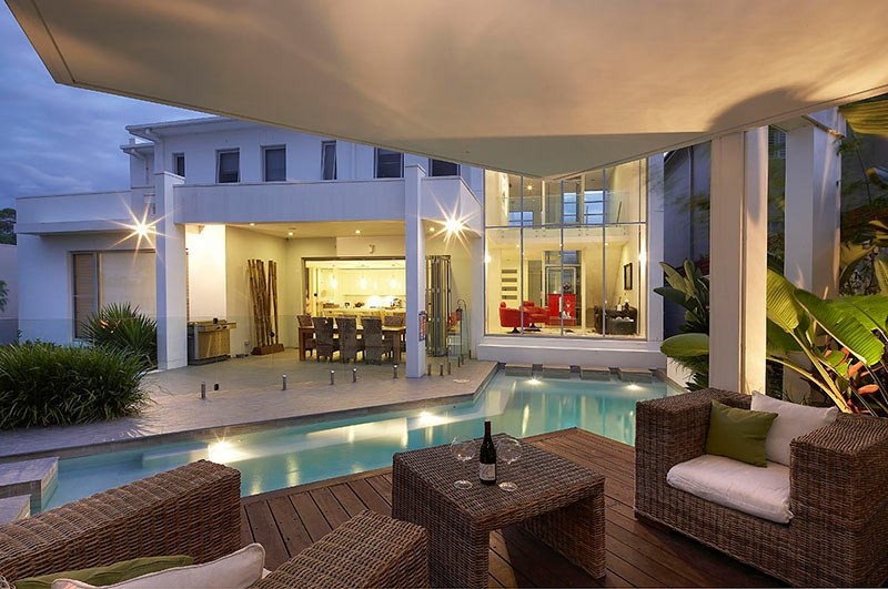 Custom Pool Area undercover patio lounge with view to main living