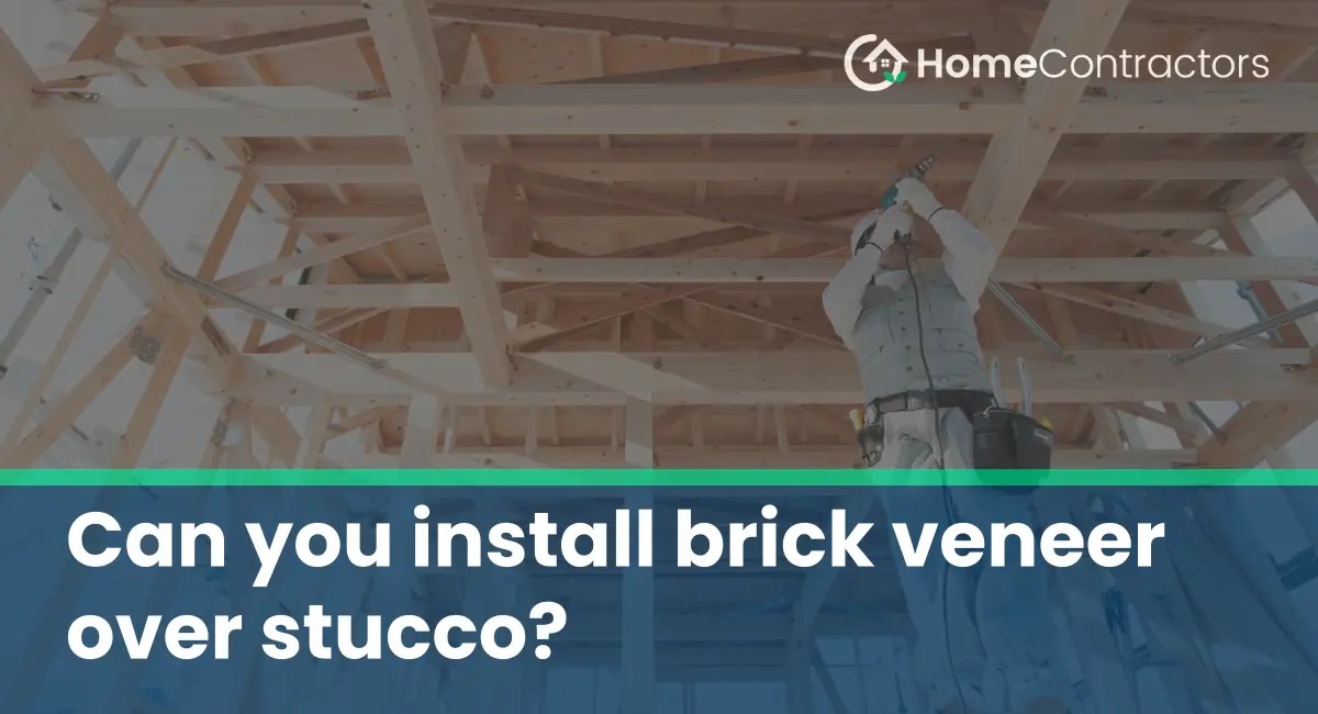 Can you install brick veneer over stucco?