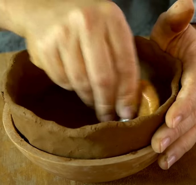 Man shows how to make homemade pottery without a kiln or pottery wheel