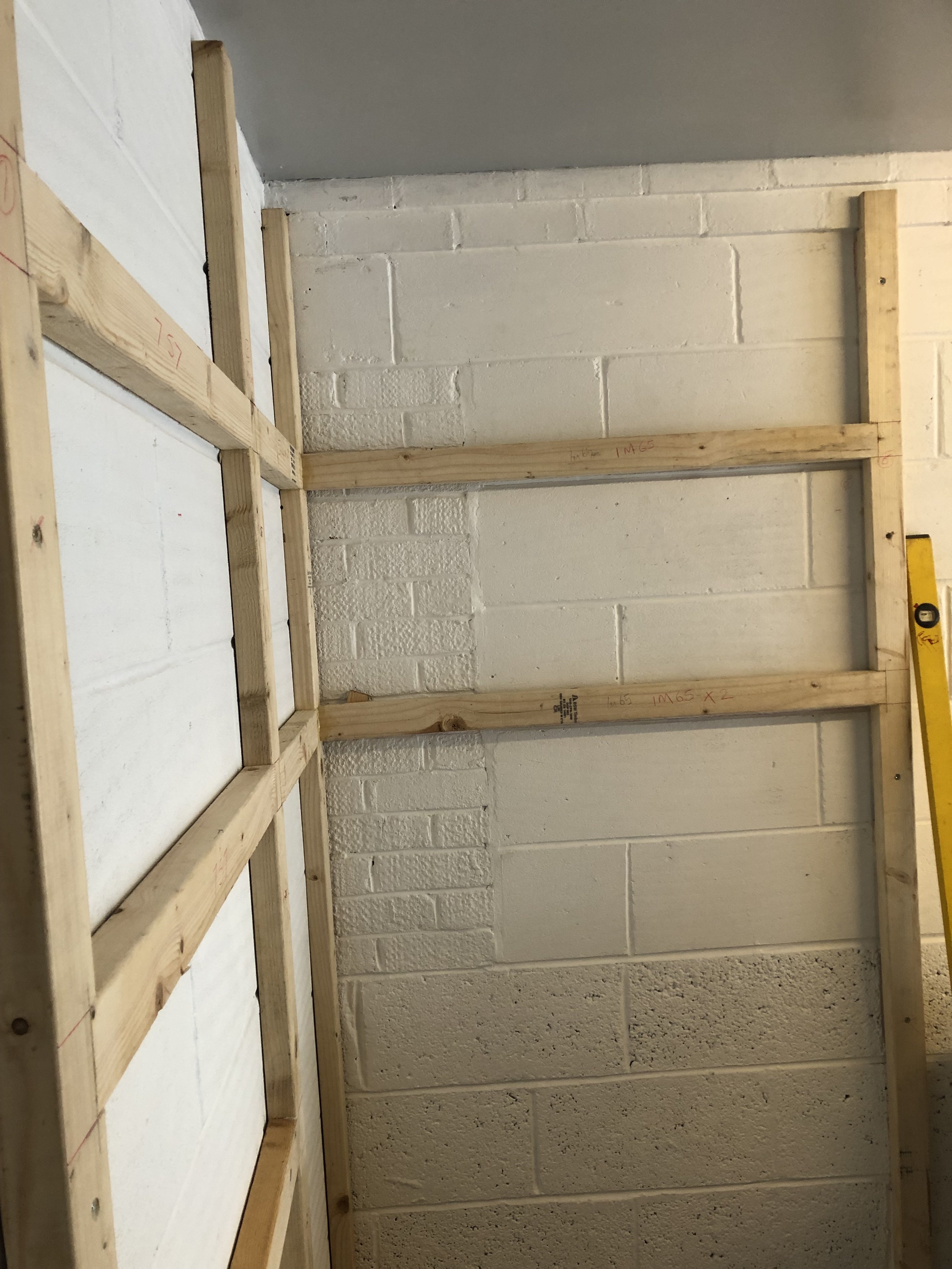 Fixings for stud wall to concrete floor and blocks? UK