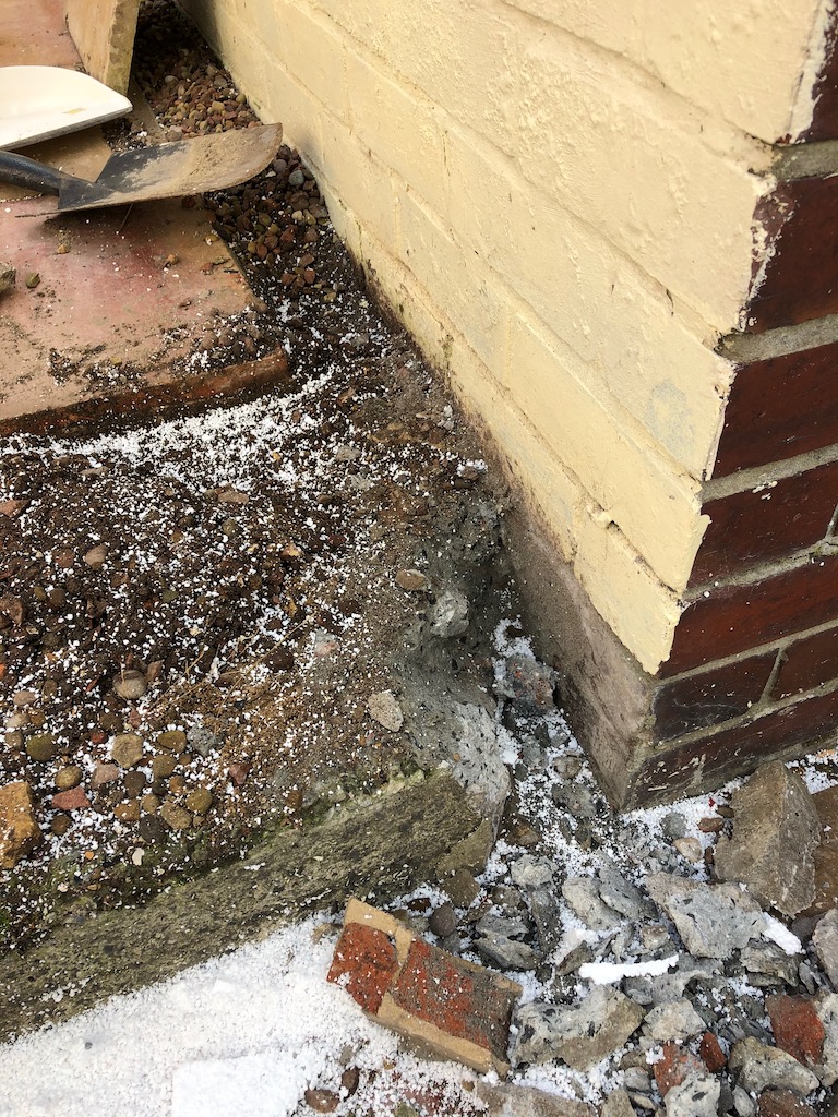 Damp in garage wall UK