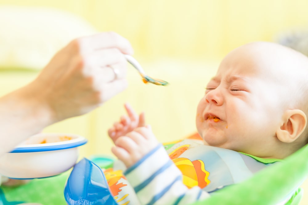 Is Your Baby Crying While Eating Solids? Reasons and Tips To Help