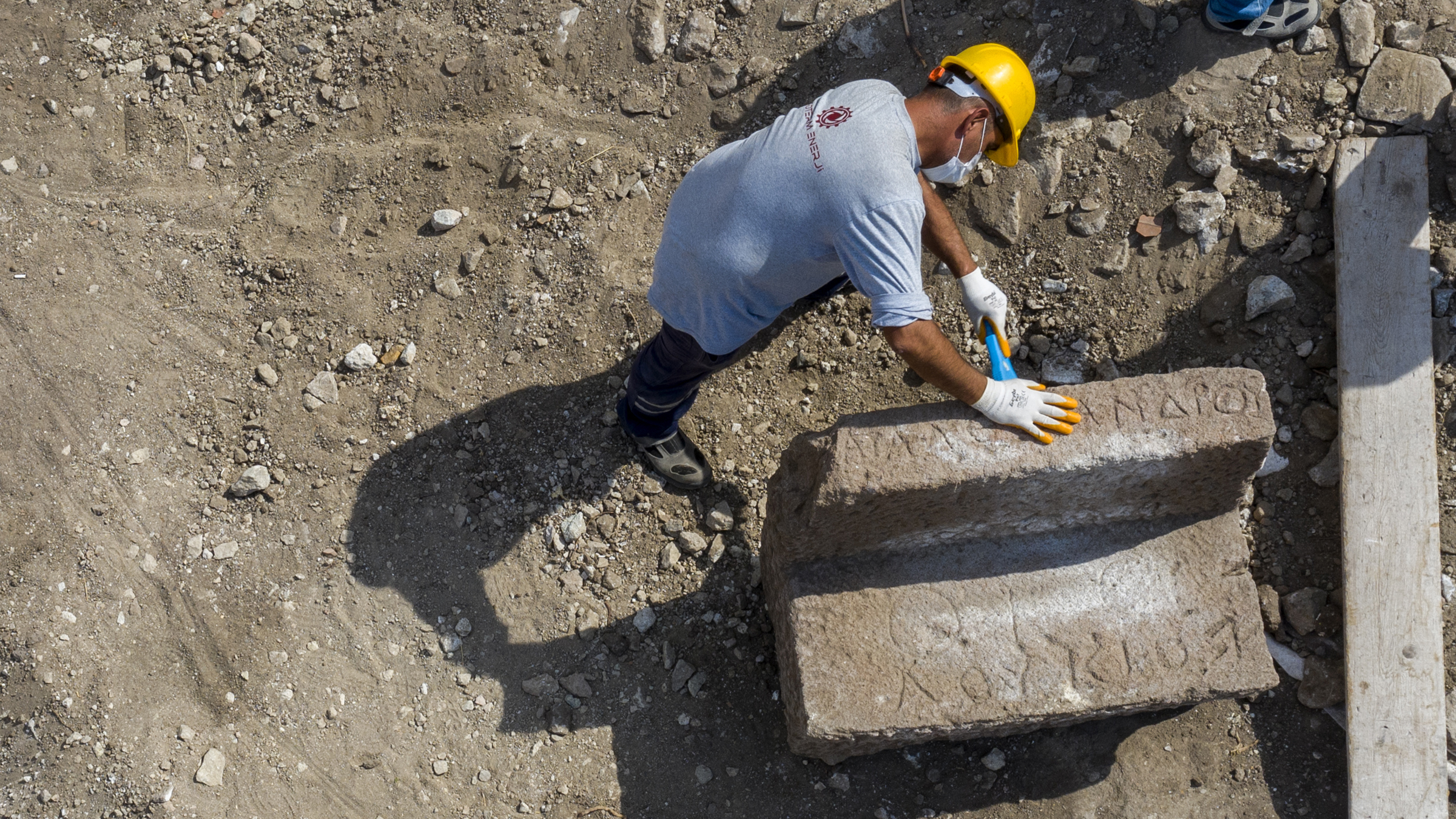 A drone shot showing a man excavating a &ldquo;box seat&rdquo; discovered at the ancient city of Pergamon.