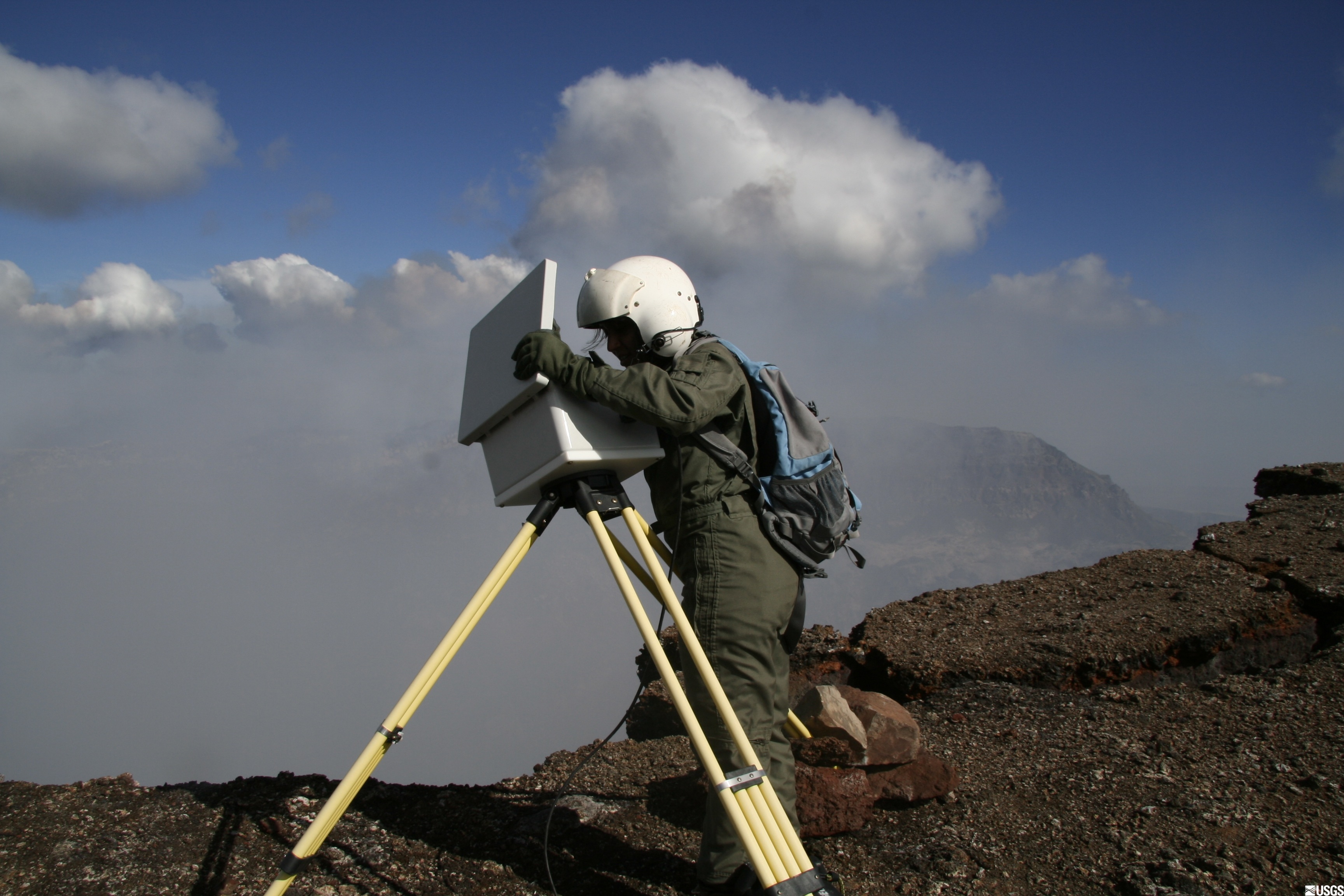 Geologist changing the data card from the time-lapse camera on the north rim of Pu&rsquo;u &lsquo;O&rsquo;o cone.