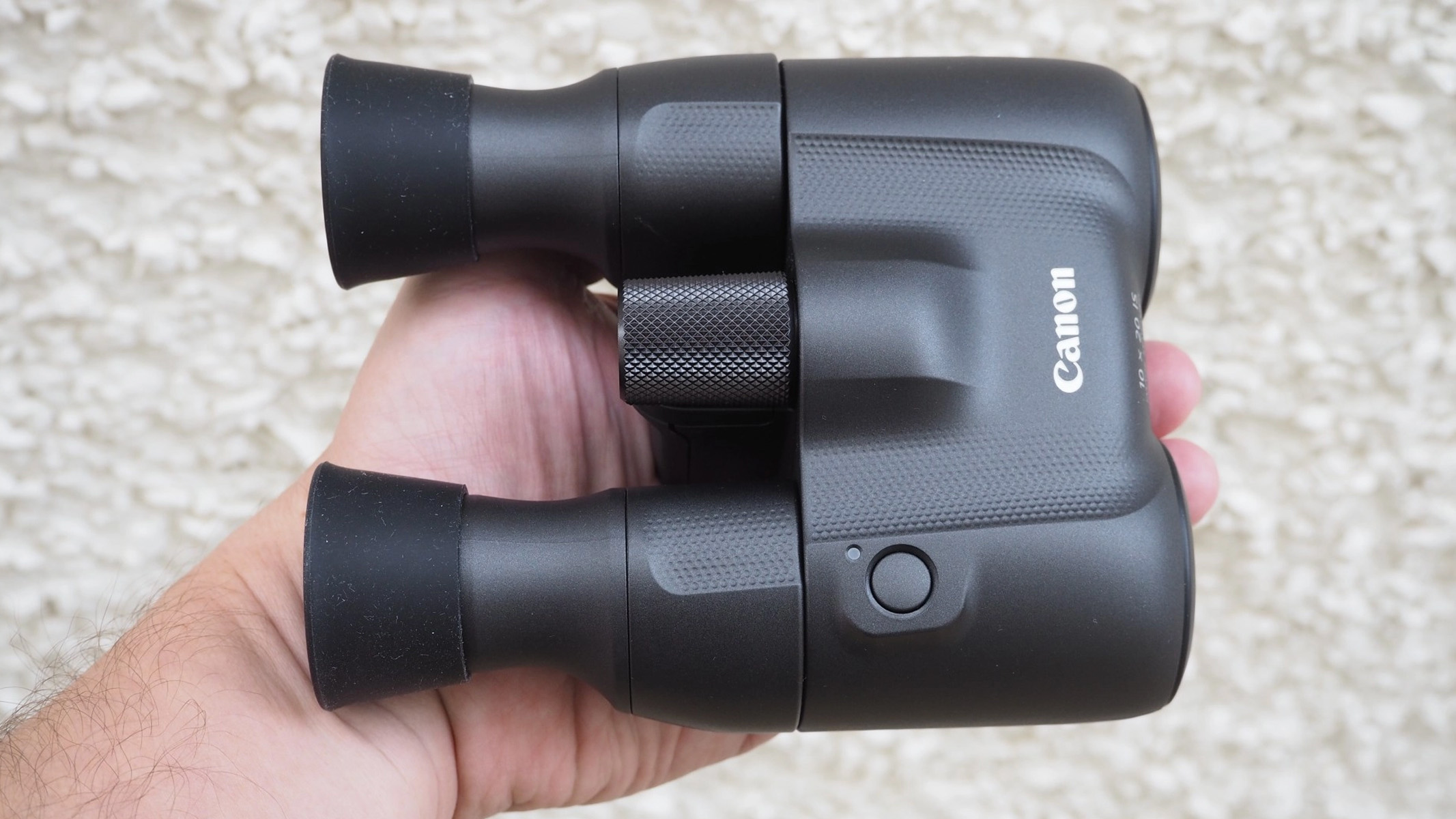 Canon 10x20 IS in the hand