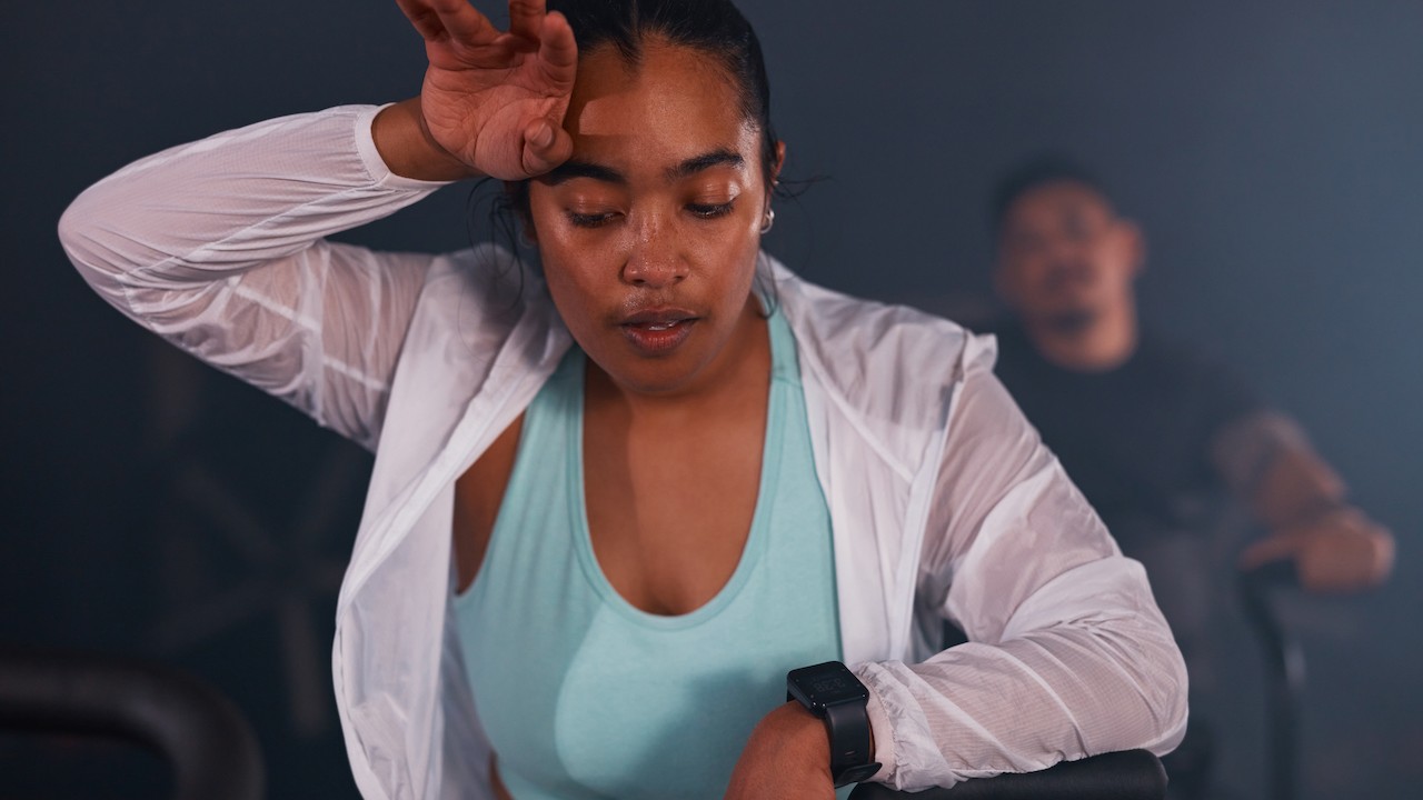 A women sweating on a bike