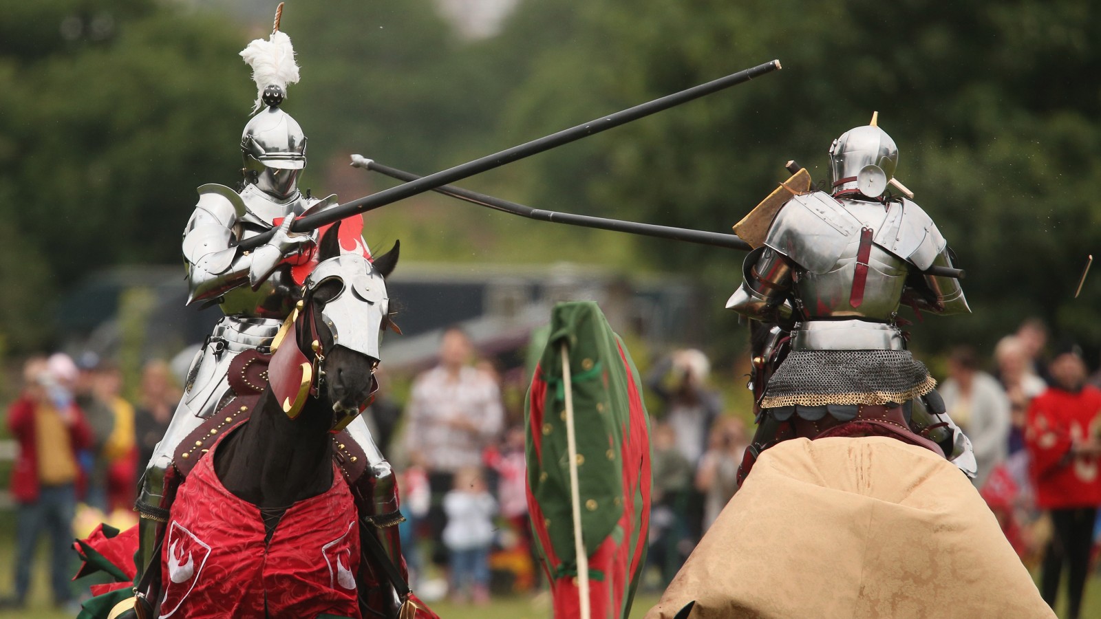 Two re-enactors jousting on horseback in medieval knights� armour