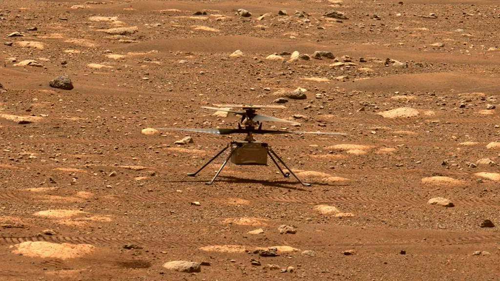 NASA�s Mars Helicopter Ingenuity is seen on the rocky red surface of Mars.