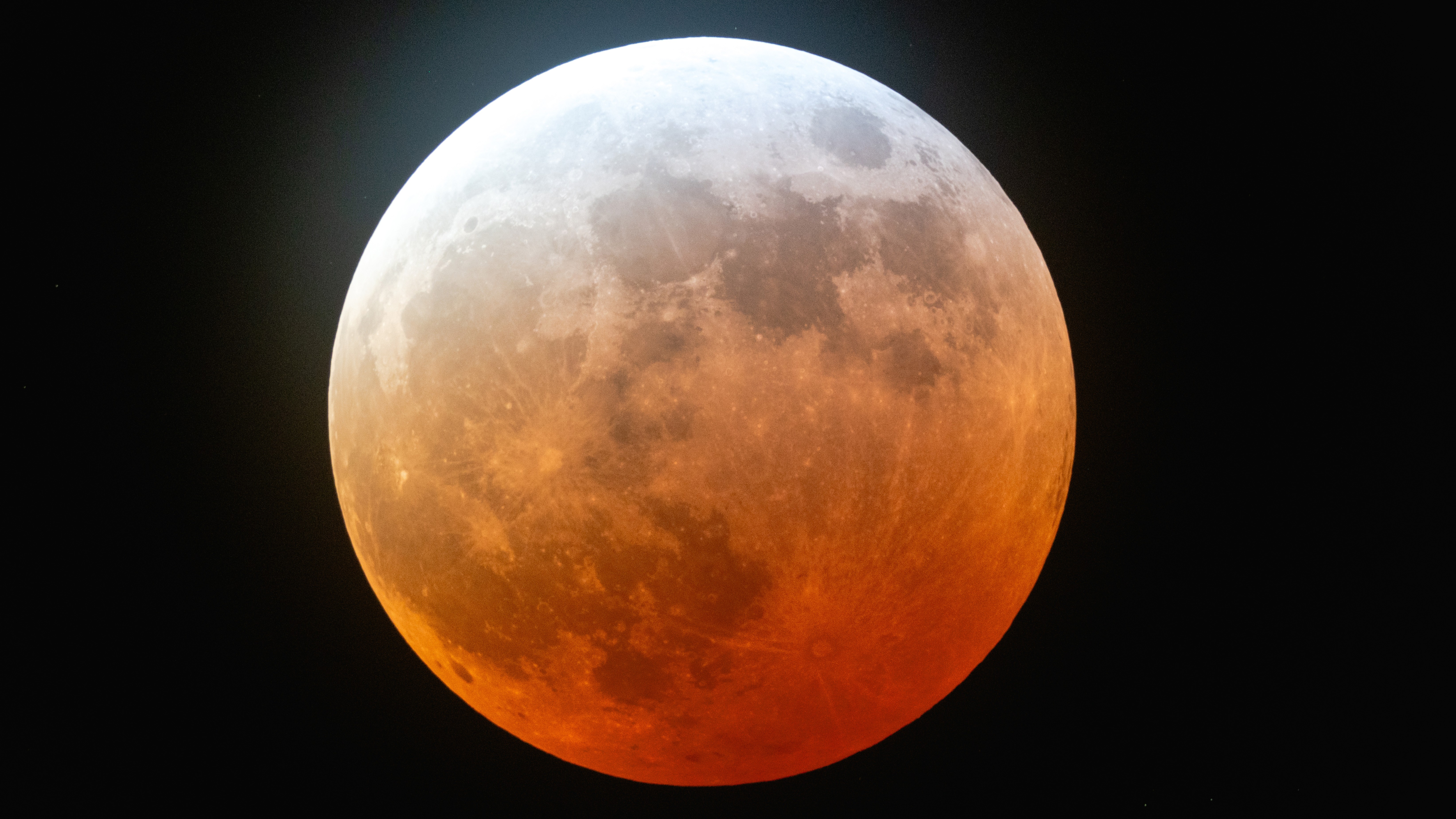 A photo of the �blood moon� hovering above Austin in March, 2025.