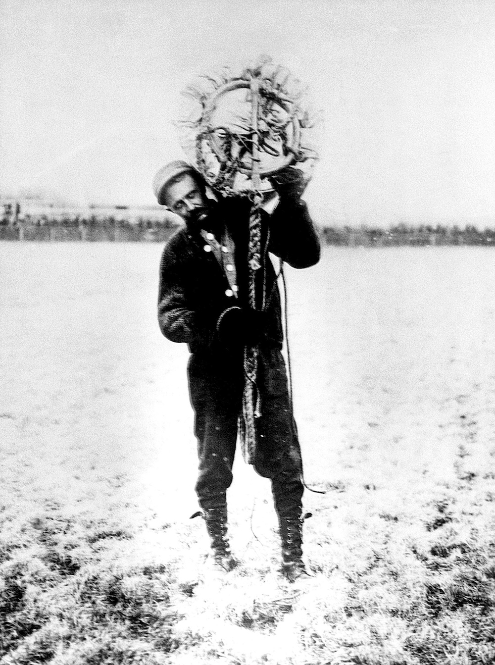 Albert Berry carries his parachute on his shoulder. He was the first person to jump from a plane with a parachute, 1912.