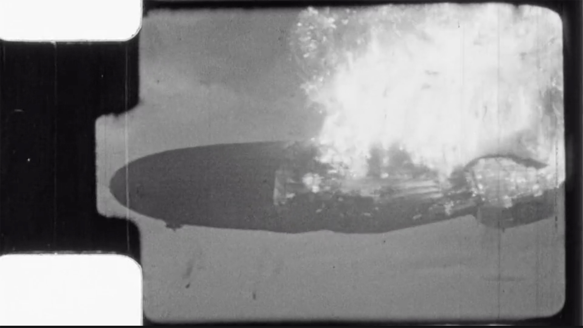 Unlike most images of the fire, footage captured by amateur photographer Harold Schenck showed the burning Hindenburg from nose to tail, in the moments after a hydrogen leak set the airship ablaze.